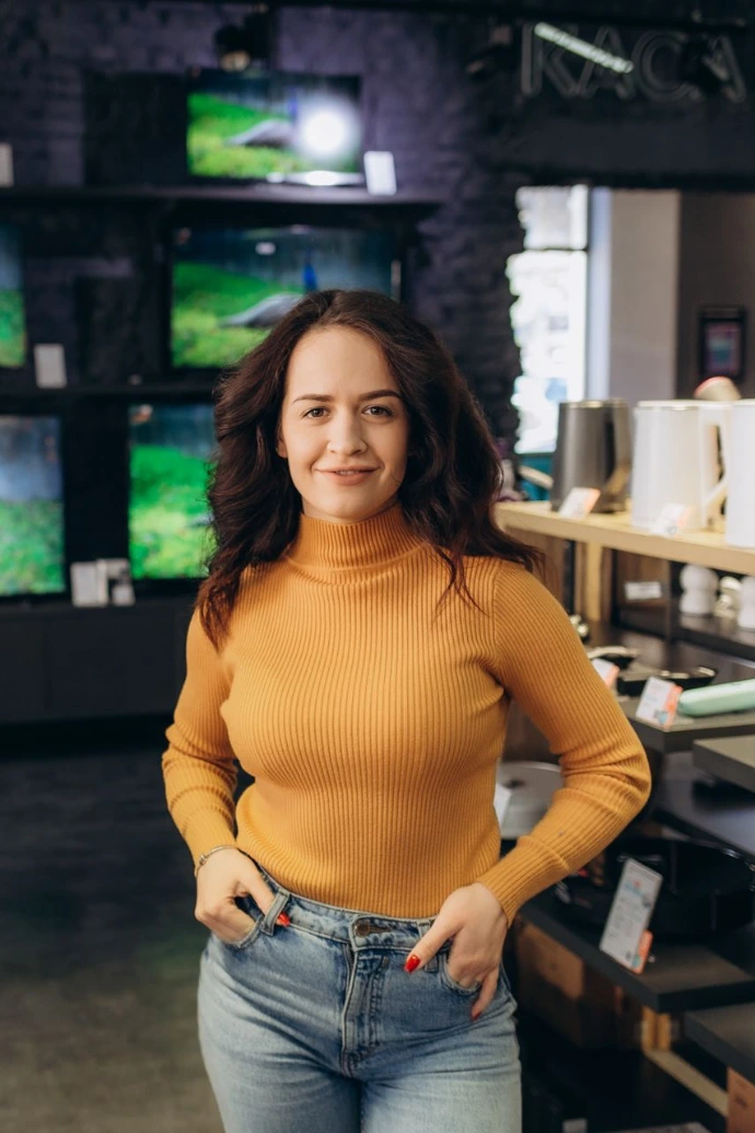 Young woman in an electronics store