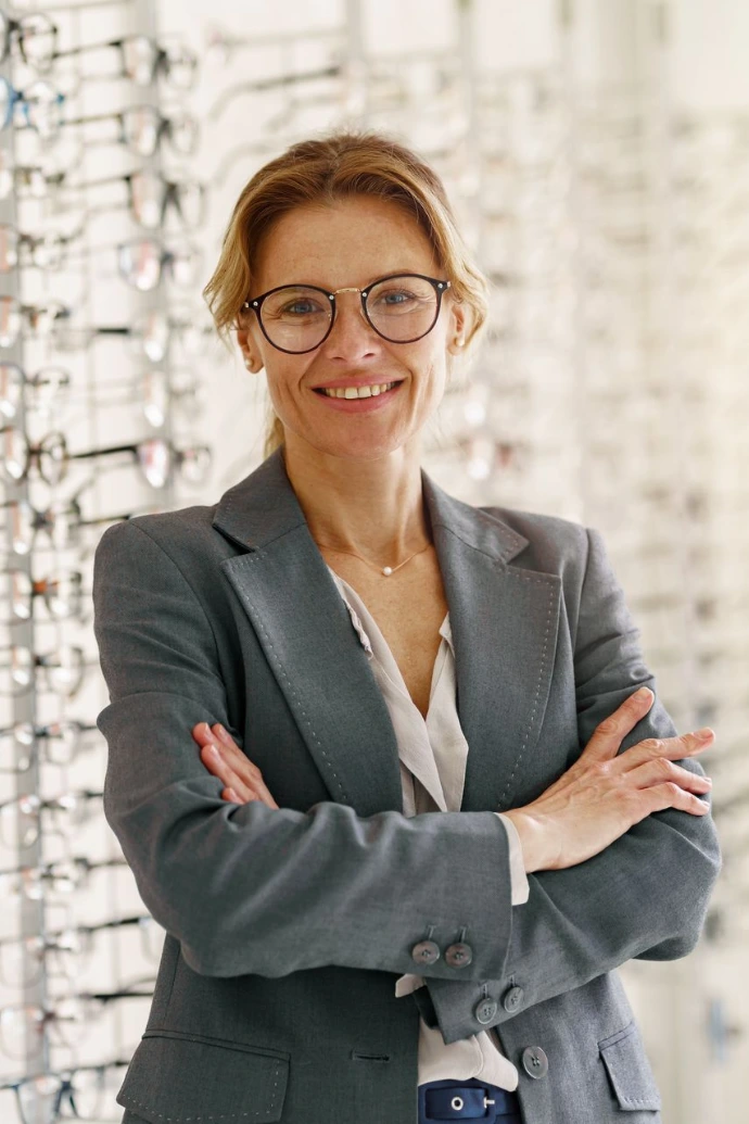 Portrait of middle-aged woman wearing glasses in optical store