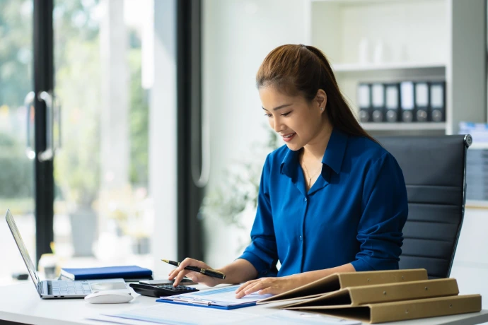 woman wording on files